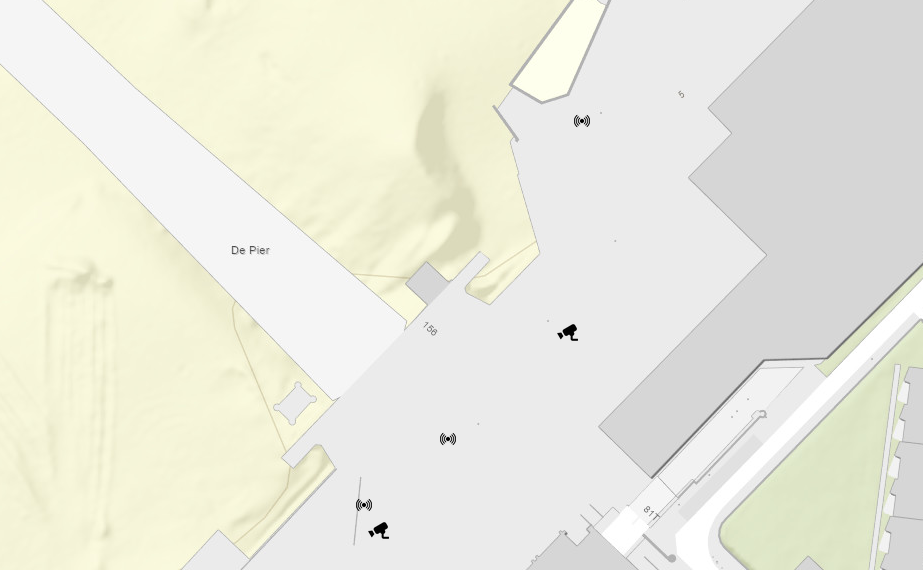 A simple map showing a built-up area, pavement, and beach. The map includes symbols showing where cameras and other sensors are located.