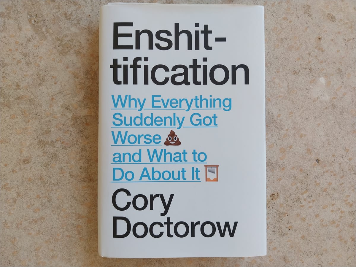 A book, seen against a concrete floor. The book is Enshittificantion by Cory Doctorow. The subtitle is "Why Everything Suddenly Got Worse and What to Do About It"